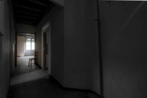 Barcelona, Catalonia, Spain, April 12: interior of an empty room with a chair and in a general state of abandonment in the city center of Barcelona in Catalonia Spain Barcelona, Catalonia, Spain, April 12: interior of an empty room with a chair and in a general state of abandonment in the city center of Barcelona in Catalonia Spain